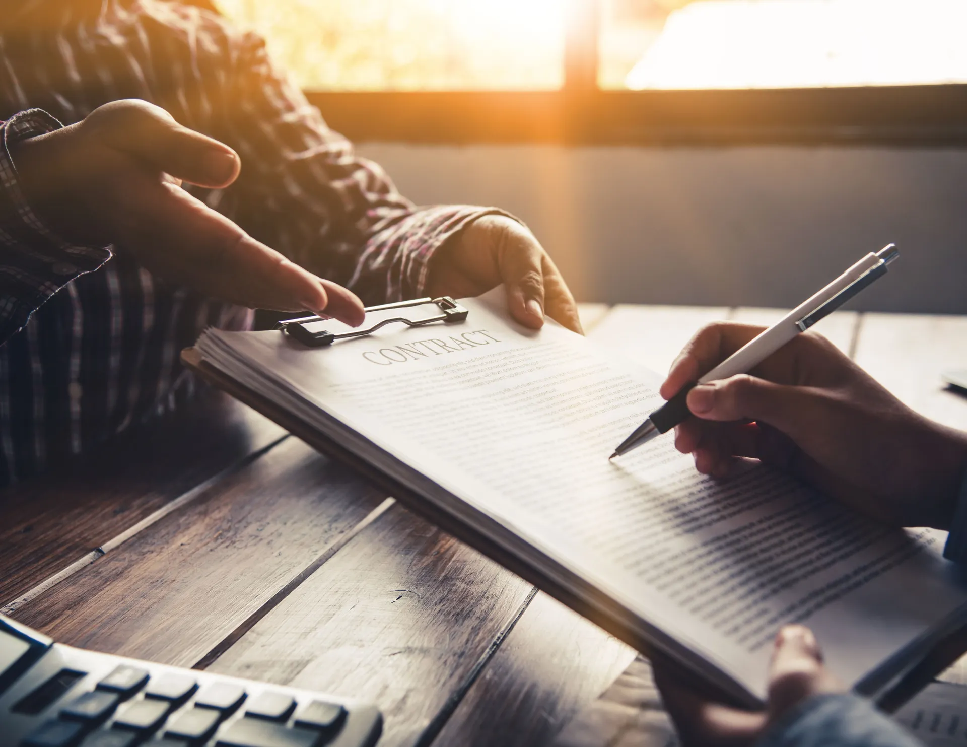 Contract signing at closing table